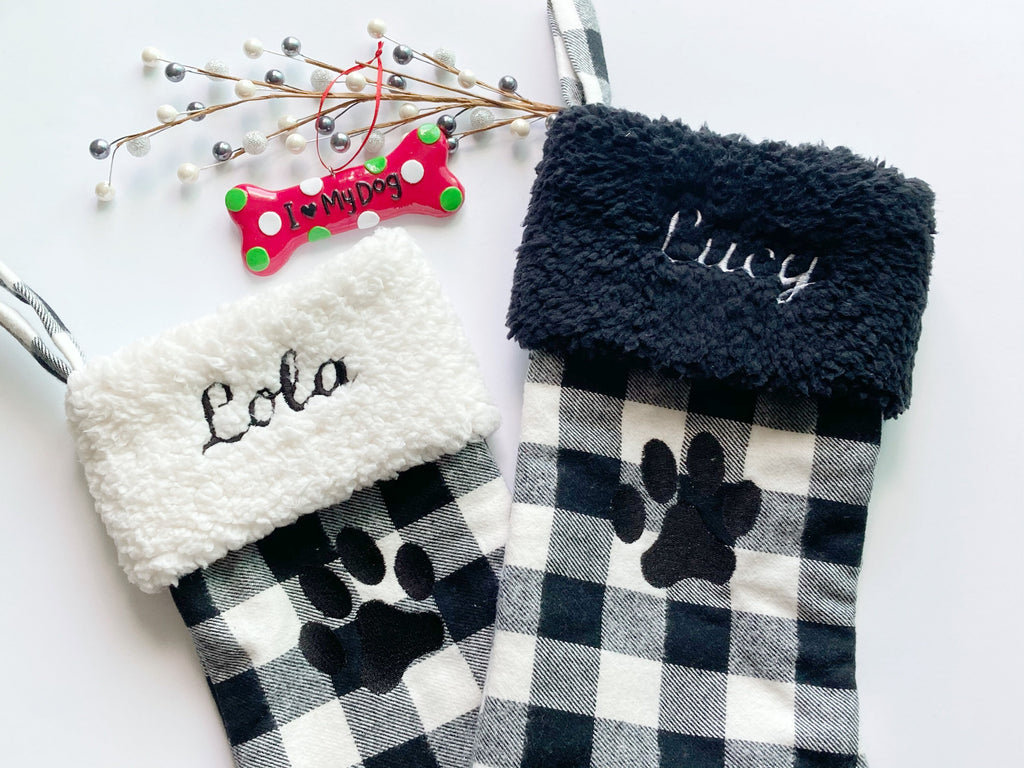 Pet personalized Christmas stocking in black and white flannel buffalo plaid for cat or dog, fully lined with embroidered paw, 18”