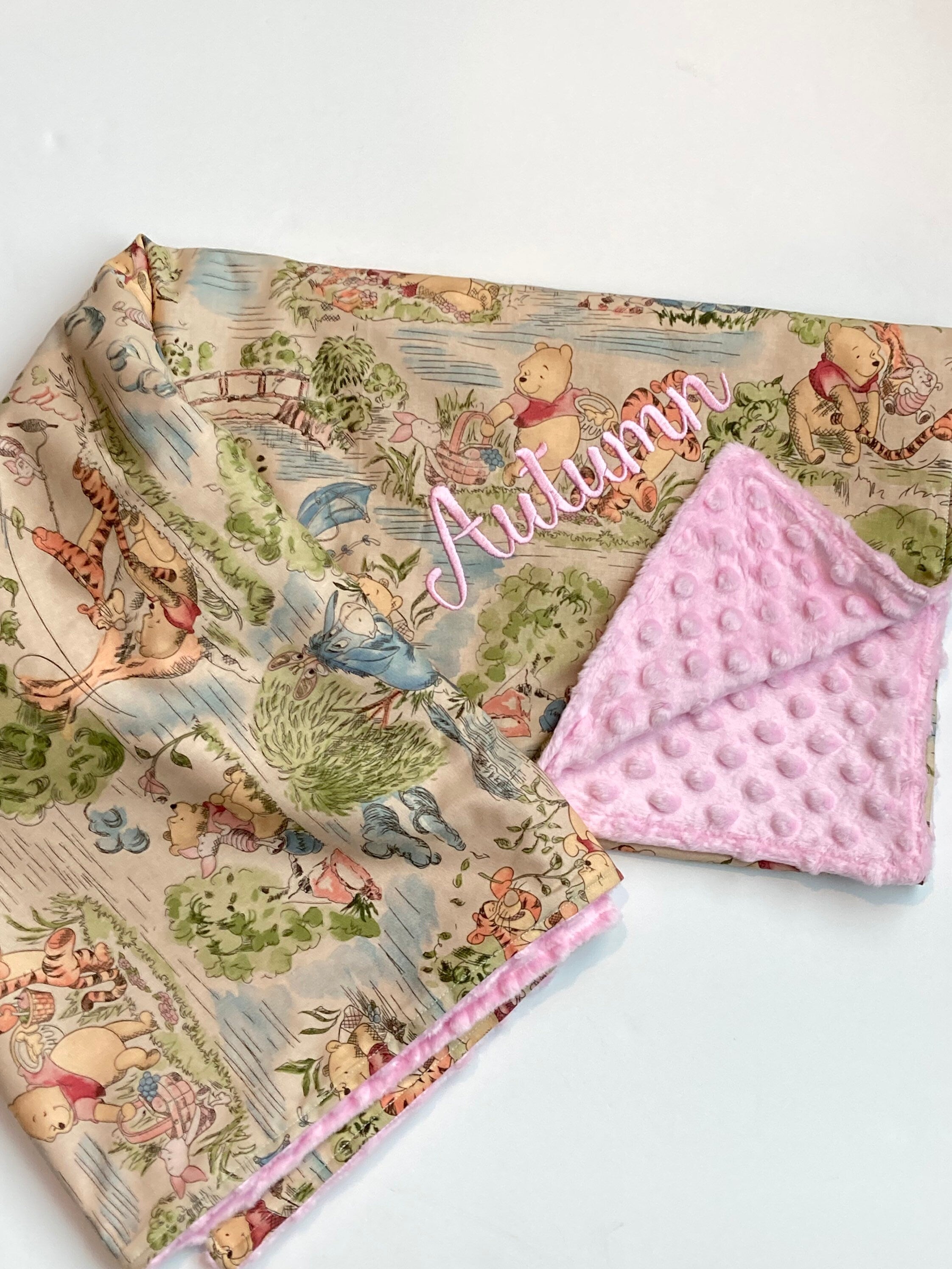 Baby blanket for nursery bedding,  personalized for girl made from Winnie the Pooh fabric in Cotton and pink soft minky baby shower gift