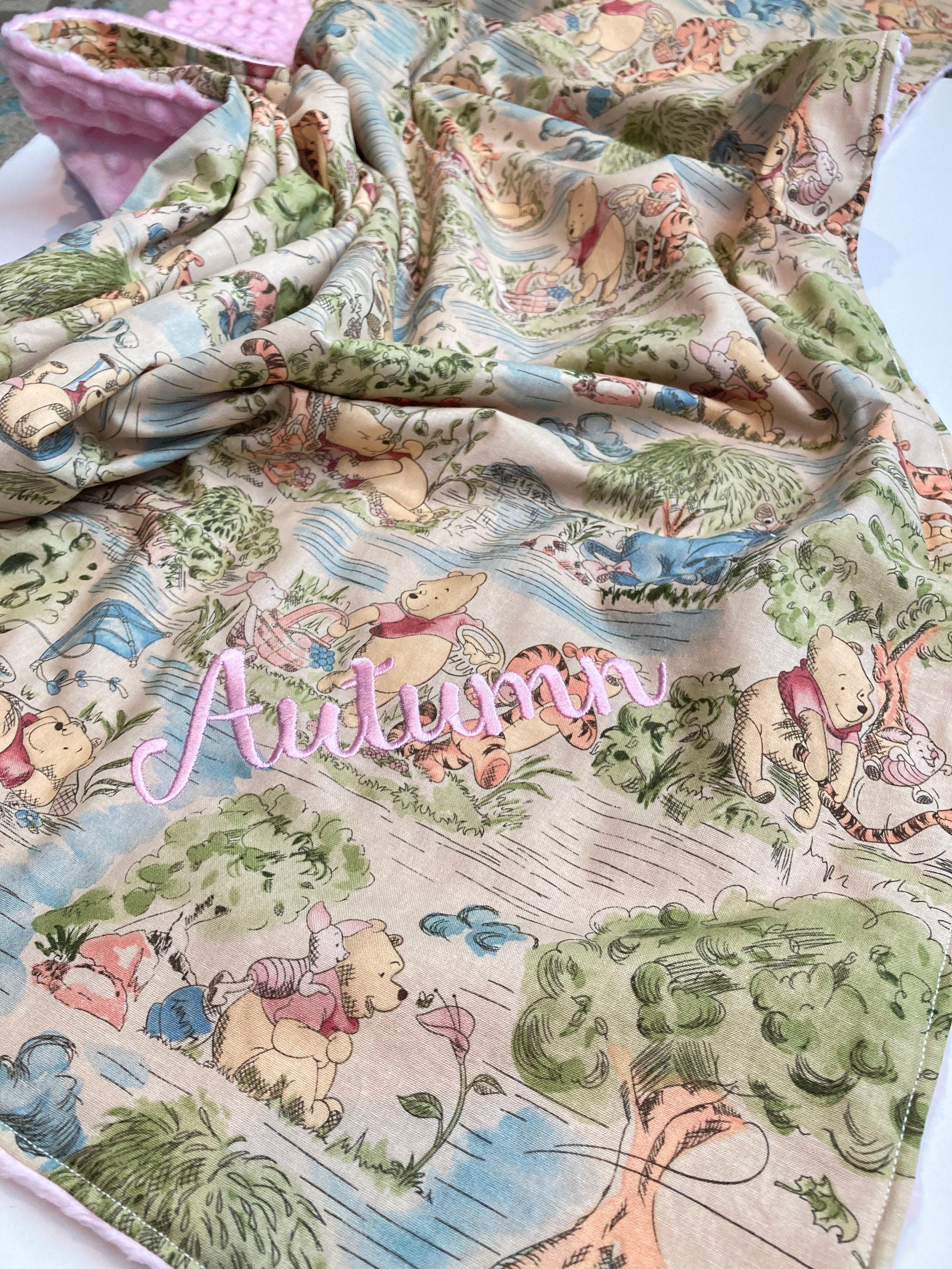 Baby blanket for nursery bedding,  personalized for girl made from Winnie the Pooh fabric in Cotton and pink soft minky baby shower gift