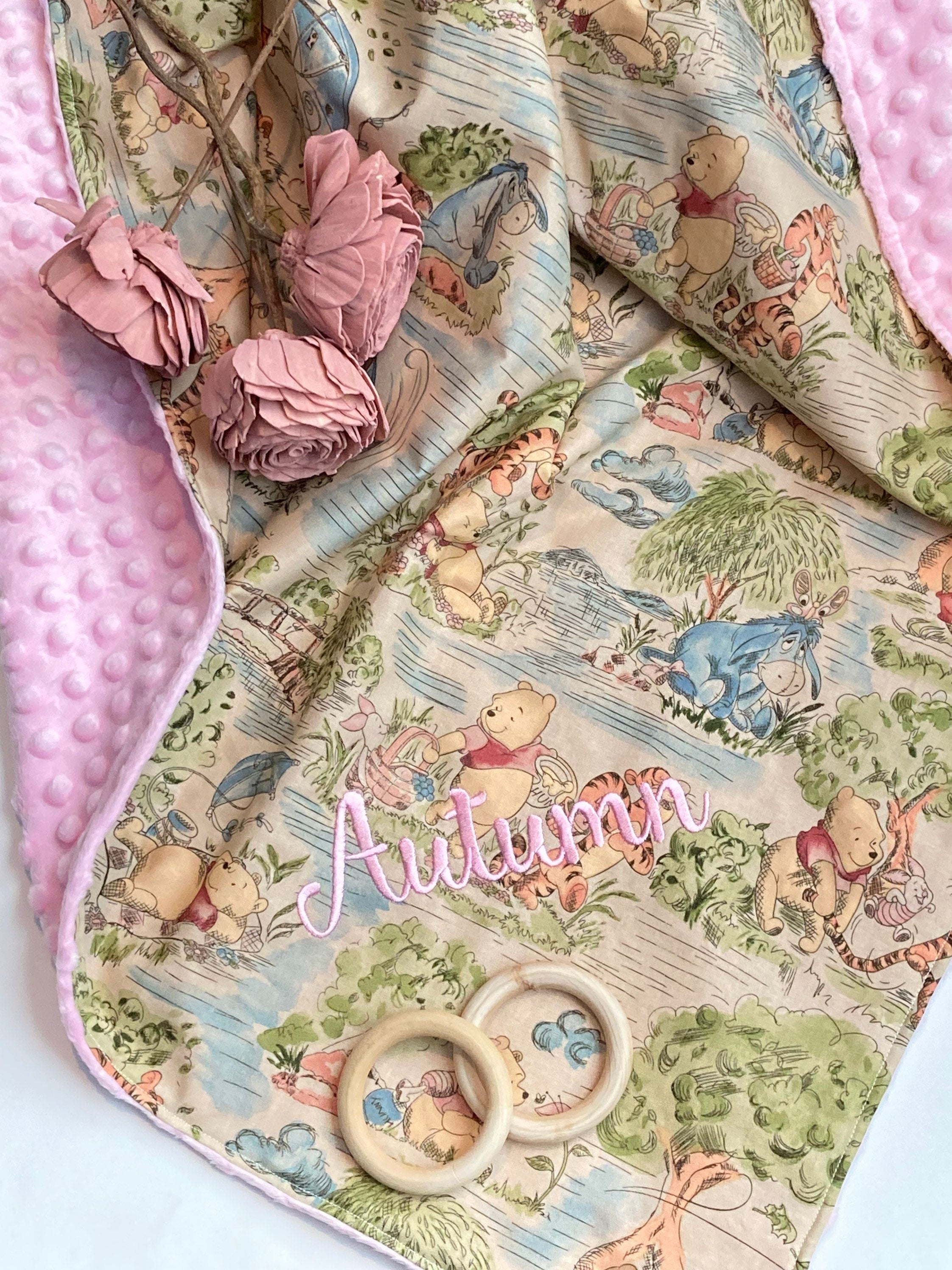 Baby blanket for nursery bedding,  personalized for girl made from Winnie the Pooh fabric in Cotton and pink soft minky baby shower gift