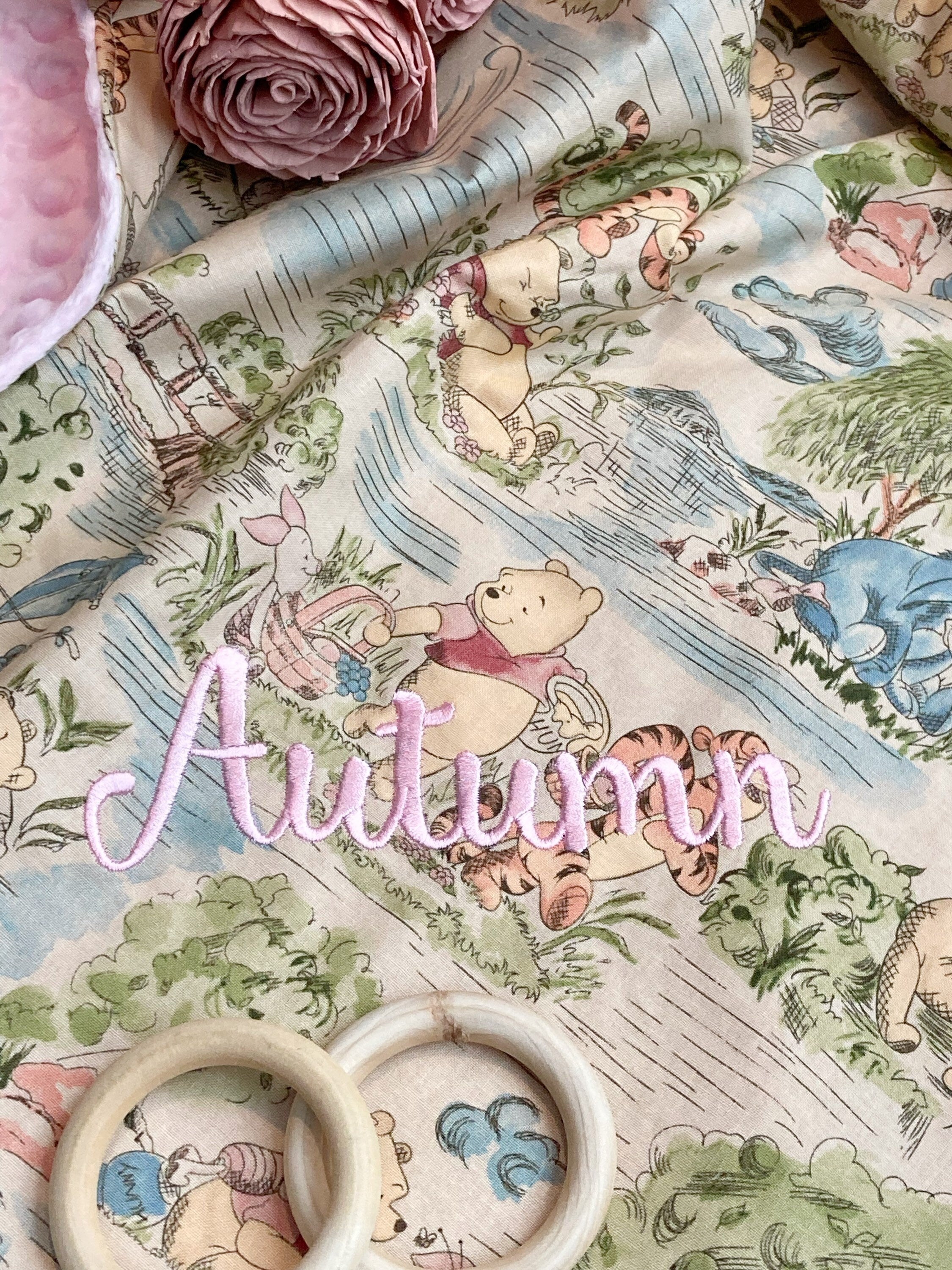 Baby blanket for nursery bedding,  personalized for girl made from Winnie the Pooh fabric in Cotton and pink soft minky baby shower gift