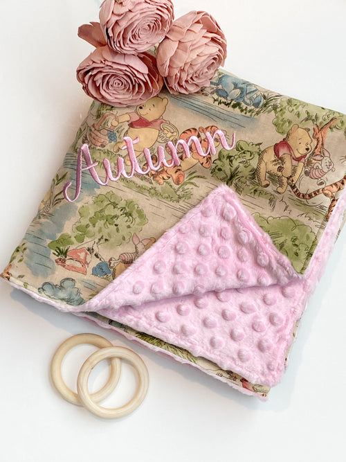 Baby blanket for nursery bedding,  personalized for girl made from Winnie the Pooh fabric in Cotton and pink soft minky baby shower gift