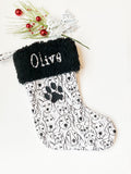 Personalized Pet Christmas stocking in dog faces outlines, classic black and white print with black cuff and fully lined, embroidered paw