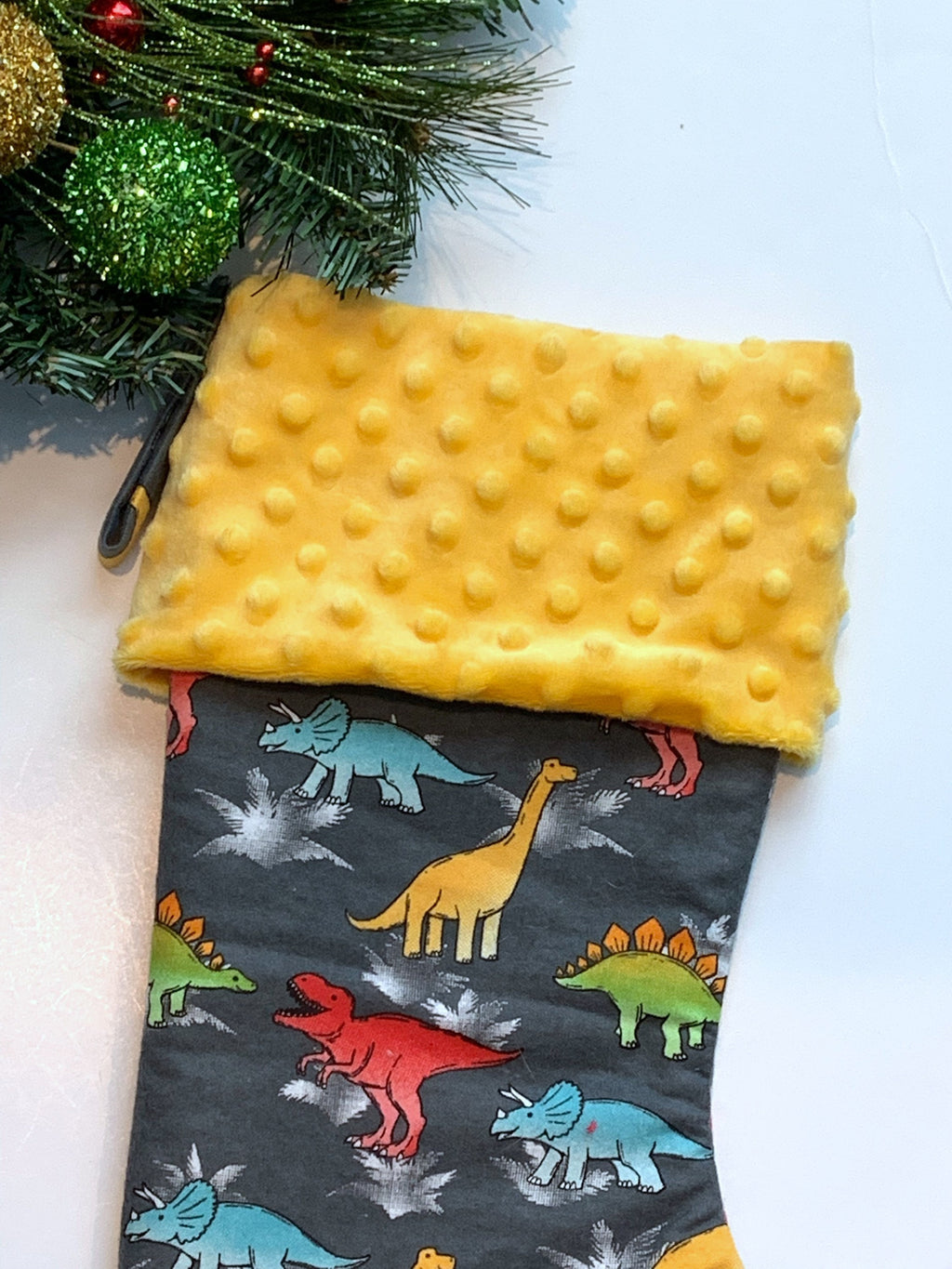 Personalized Christmas stocking in flannel dinosaur  fabric, fully lined with minky dot cuff, 18” length, unique child stocking