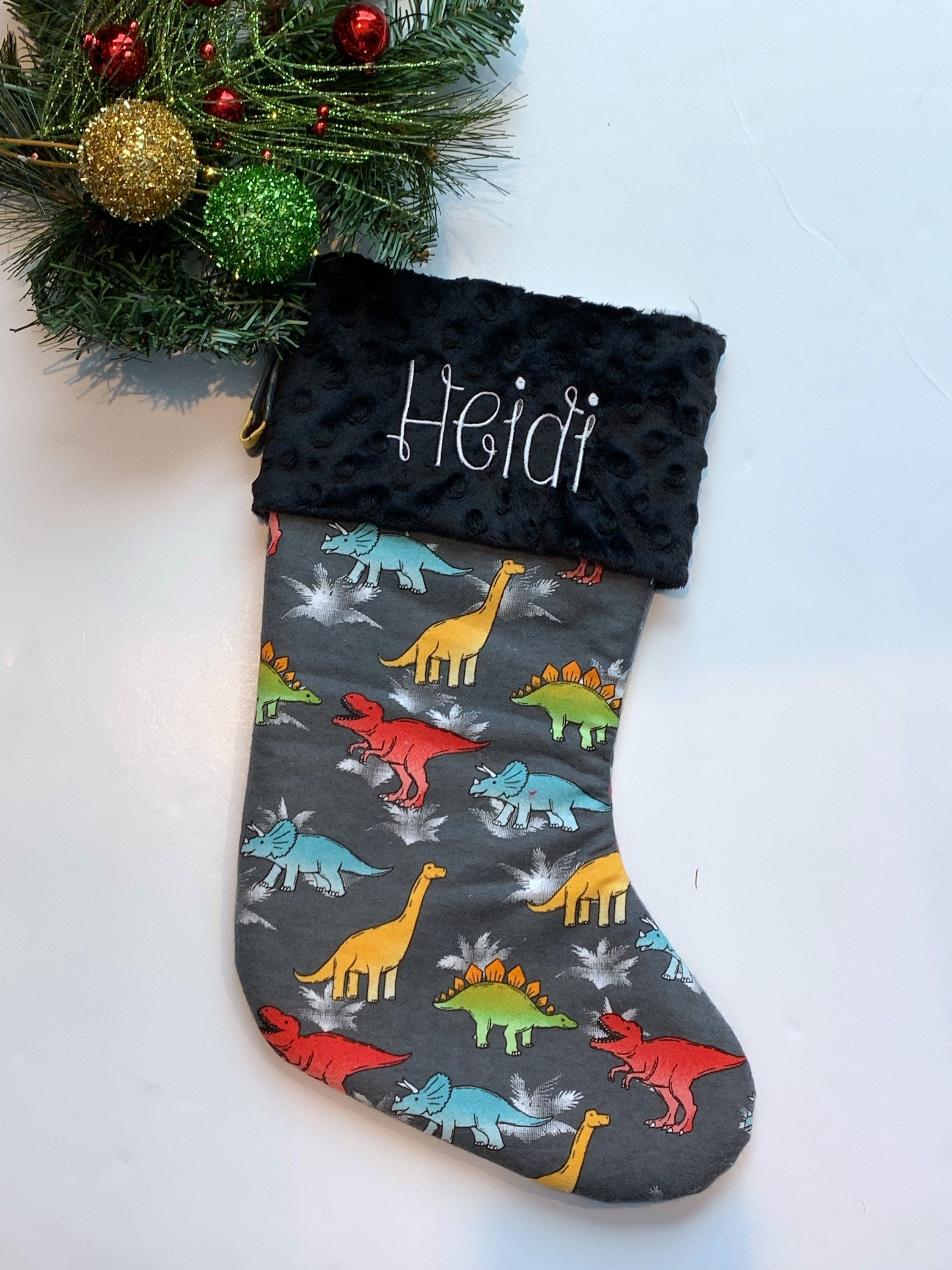 Personalized Christmas stocking in flannel dinosaur  fabric, fully lined with minky dot cuff, 18” length, unique child stocking