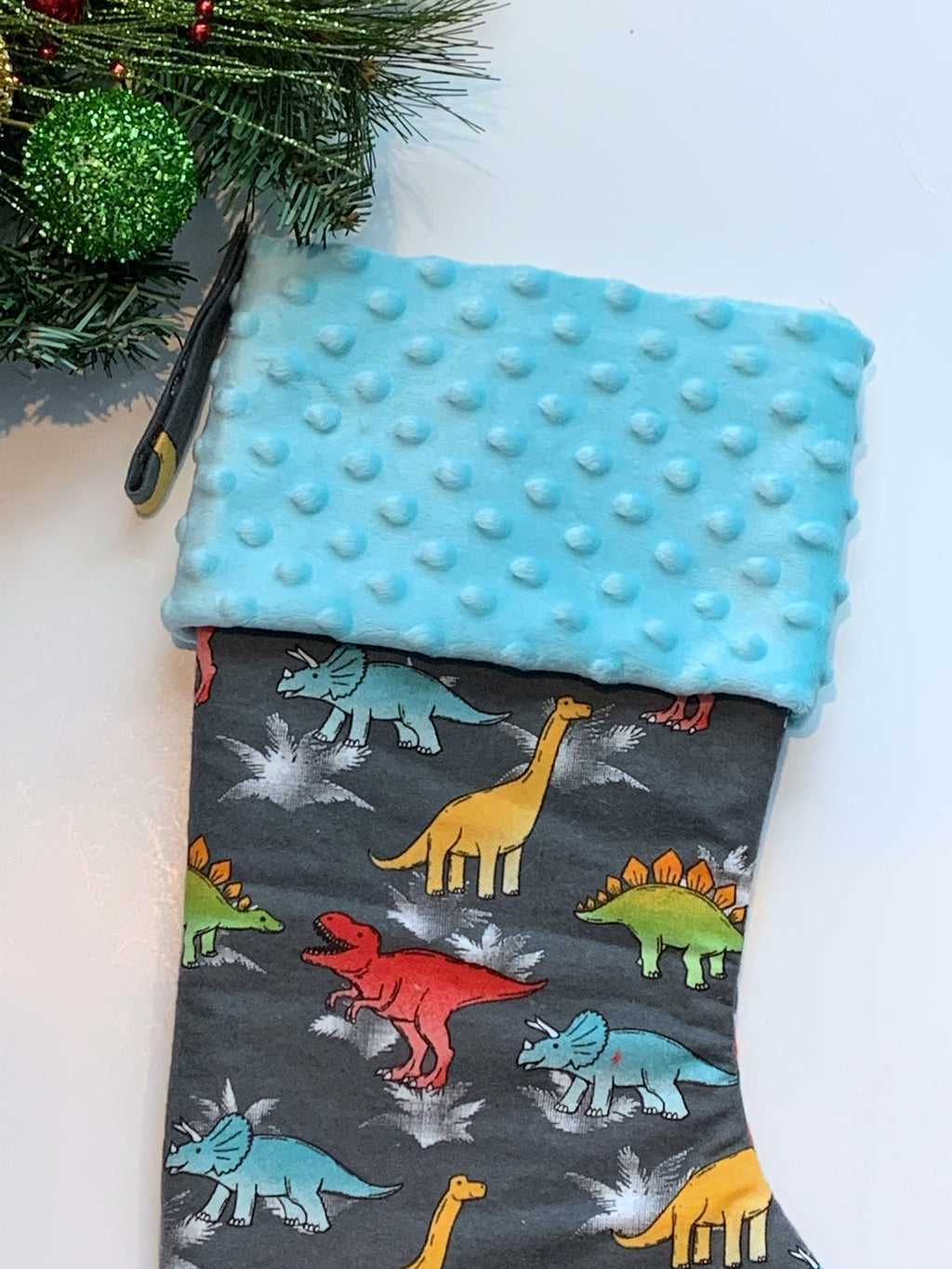 Personalized Christmas stocking in flannel dinosaur  fabric, fully lined with minky dot cuff, 18” length, unique child stocking