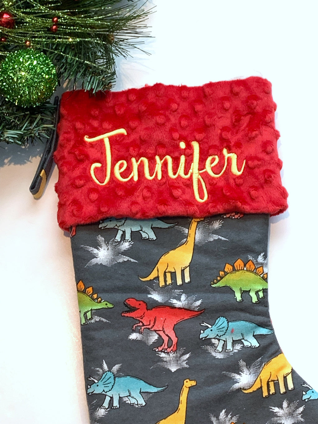 Personalized Christmas stocking in flannel dinosaur  fabric, fully lined with minky dot cuff, 18” length, unique child stocking