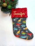 Personalized Christmas stocking in flannel dinosaur  fabric, fully lined with minky dot cuff, 18” length, unique child stocking