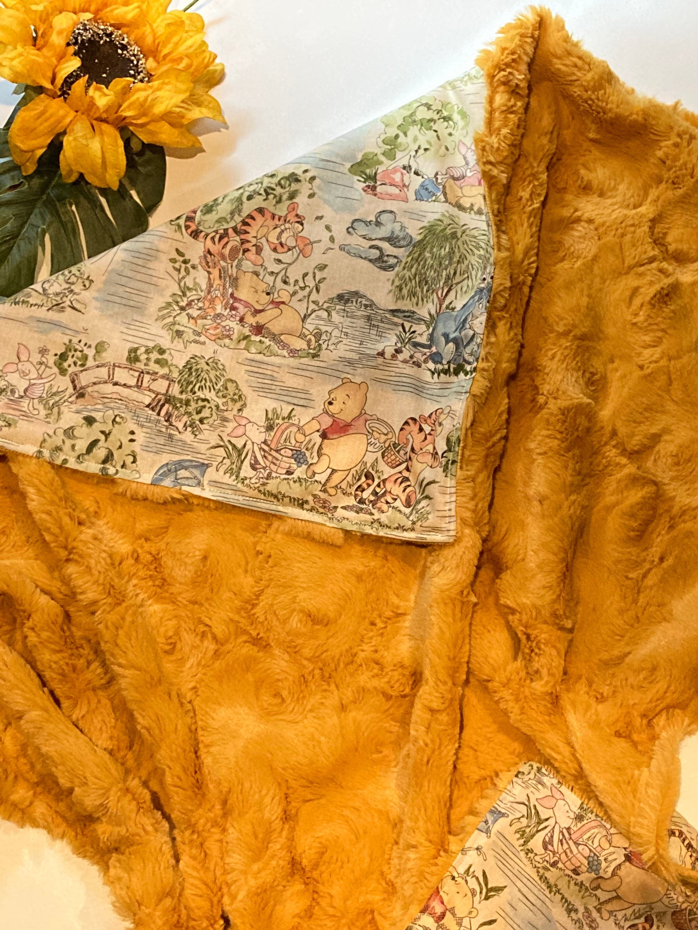 Personalized baby nursery blanket made from Winnie the Pooh fabric for boy or girl, cotton and minky or fur with Winnie embroidered option