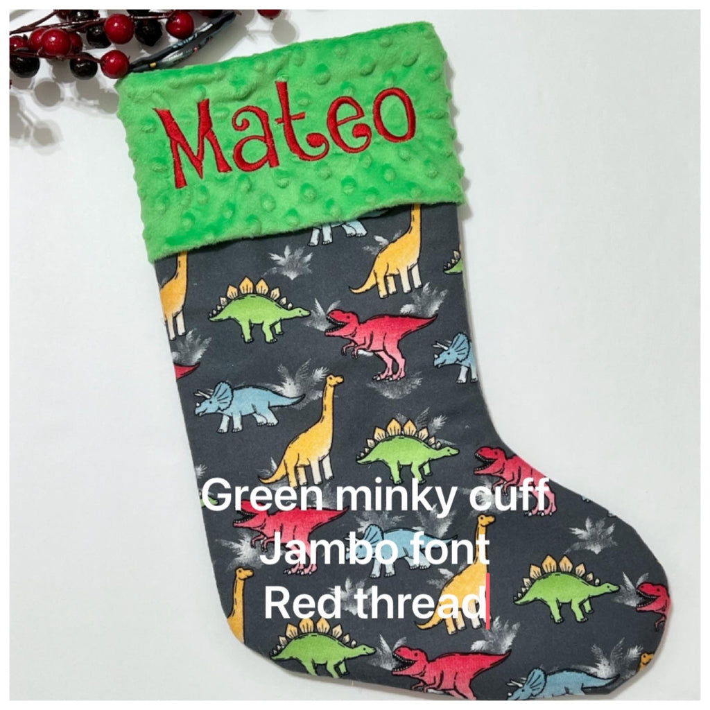 Personalized Christmas stocking in flannel dinosaur  fabric, fully lined with minky dot cuff, 18” length, unique child stocking