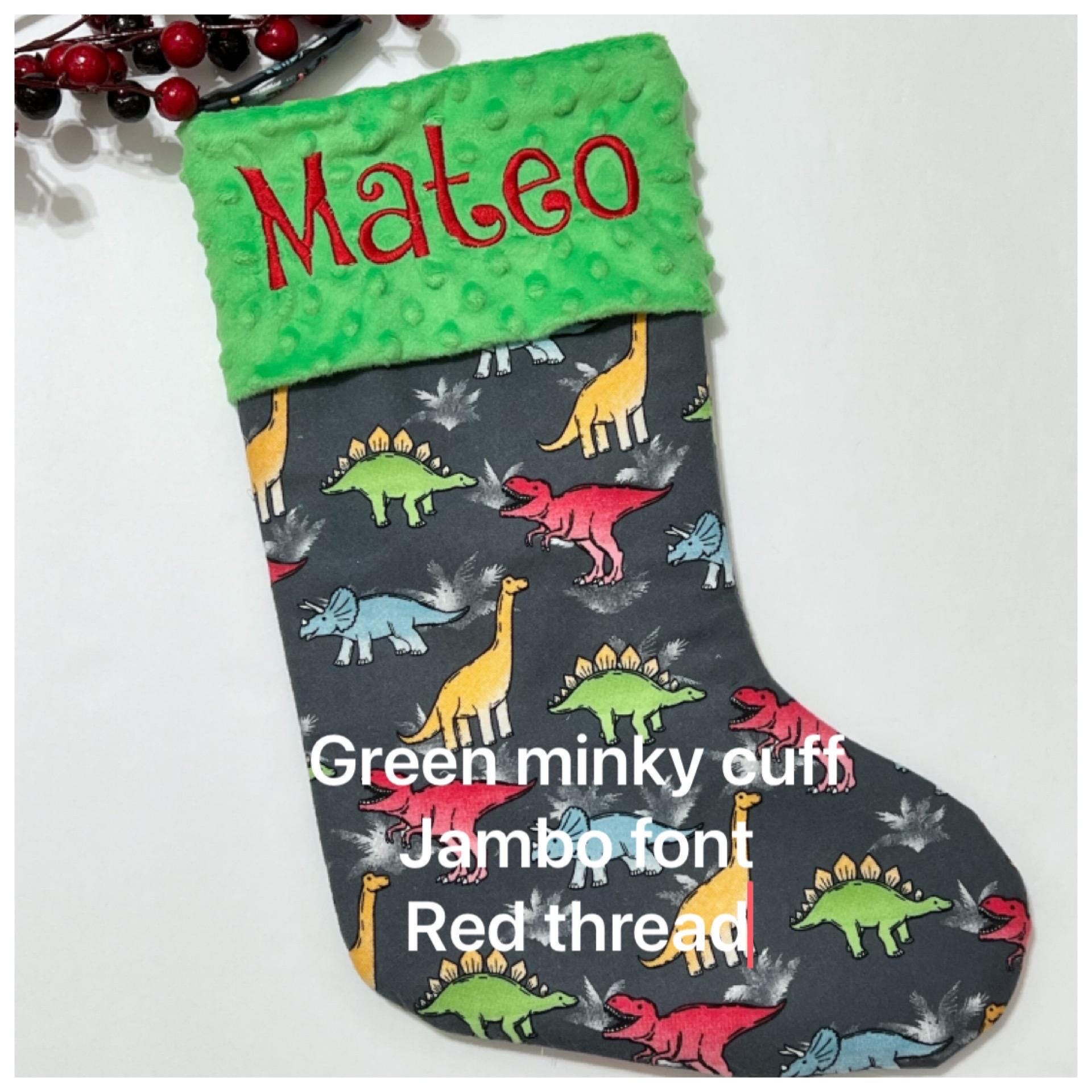 Personalized Christmas stocking in flannel dinosaur  fabric, fully lined with minky dot cuff, 18” length, unique child stocking