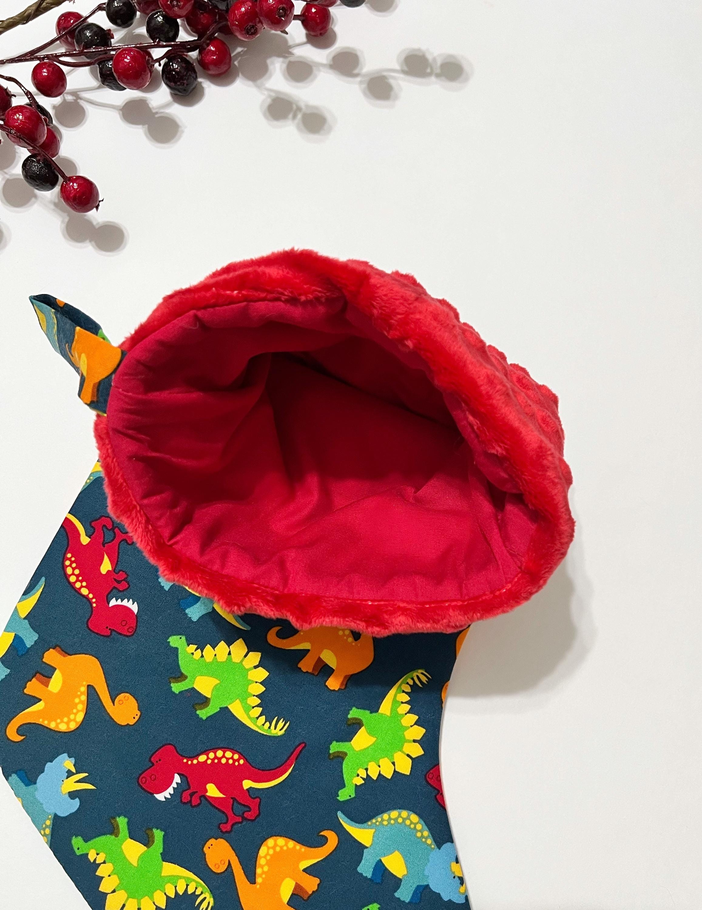Personalized Christmas stocking in dinosaur cotton fabric, fully lined with minky dot cuff, 18” length, unique child stocking