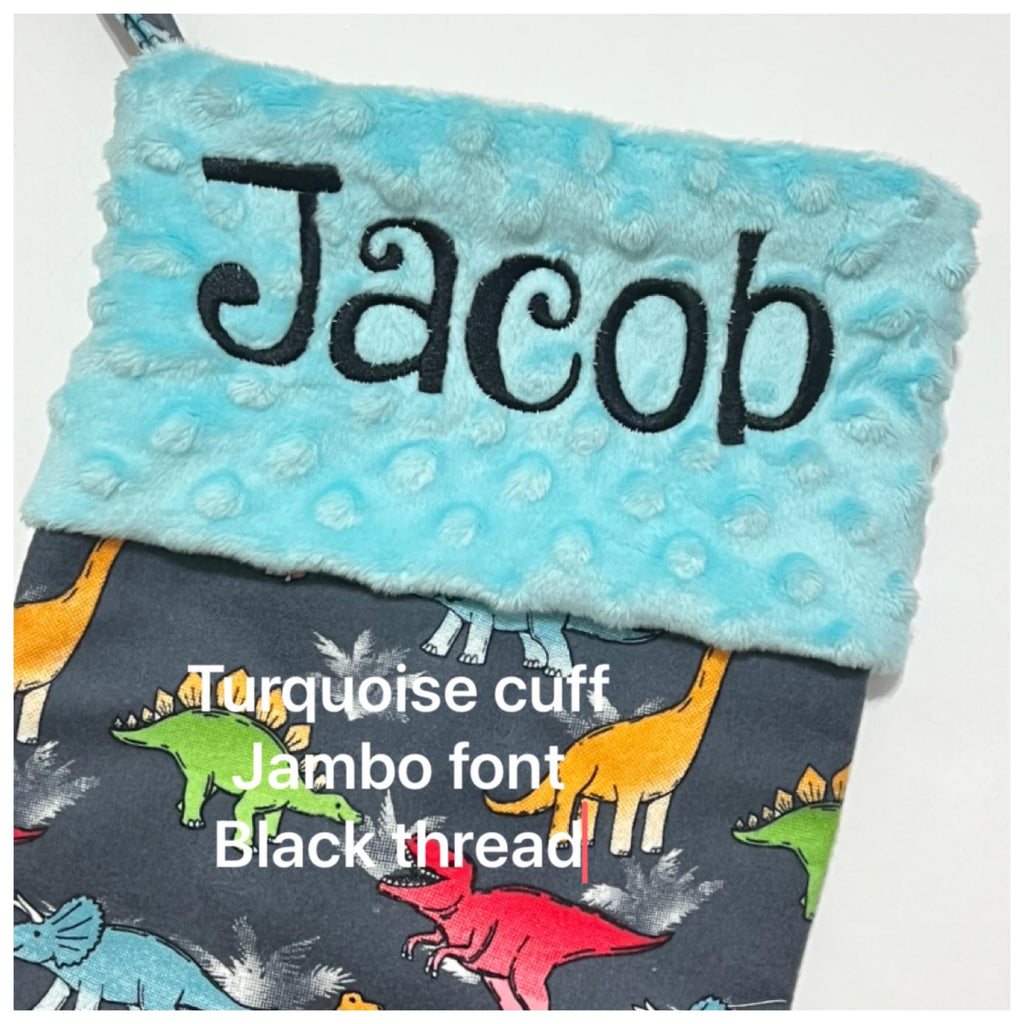 Personalized Christmas stocking in flannel dinosaur  fabric, fully lined with minky dot cuff, 18” length, unique child stocking