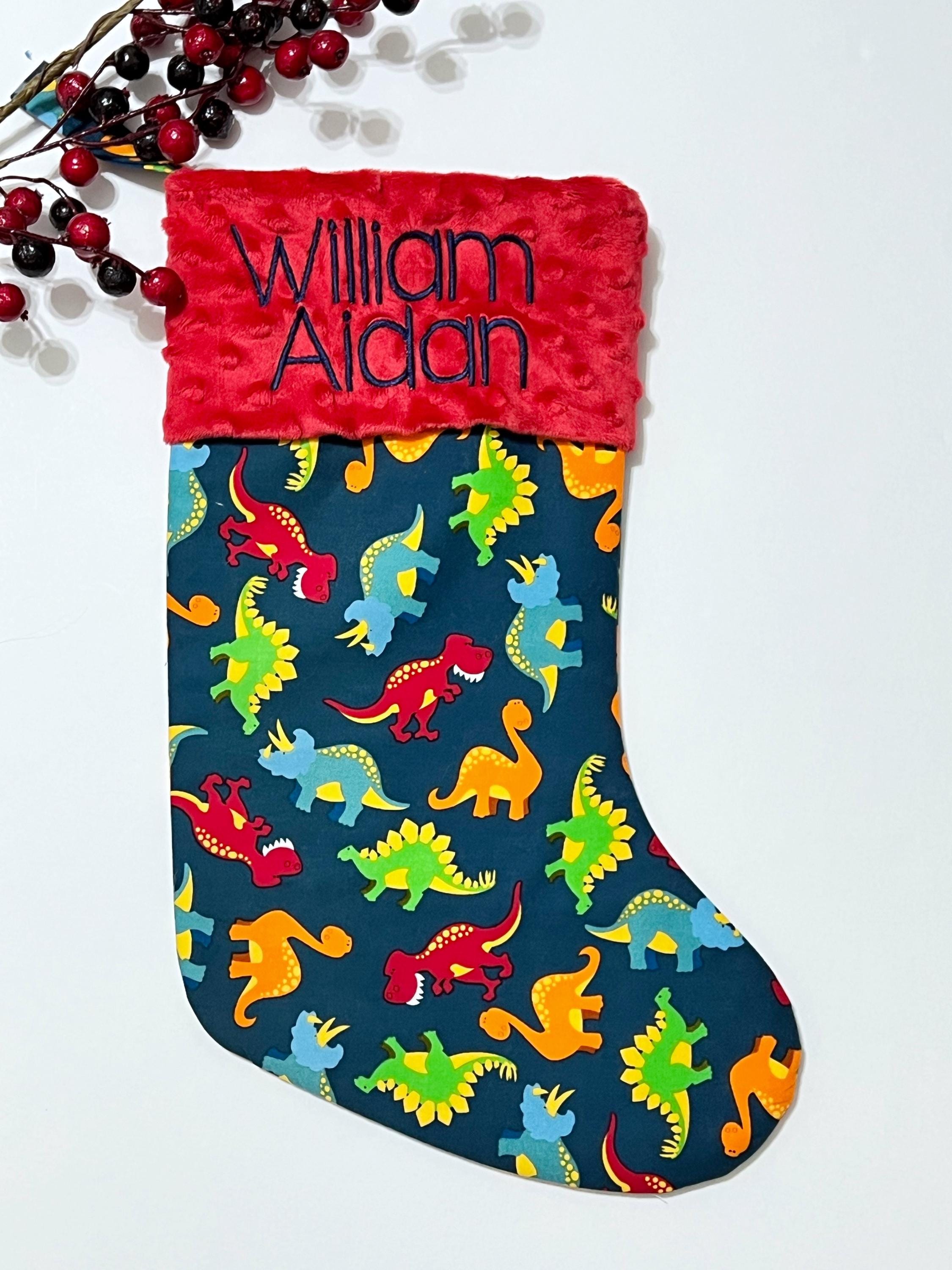 Personalized Christmas stocking in dinosaur cotton fabric, fully lined with minky dot cuff, 18” length, unique child stocking
