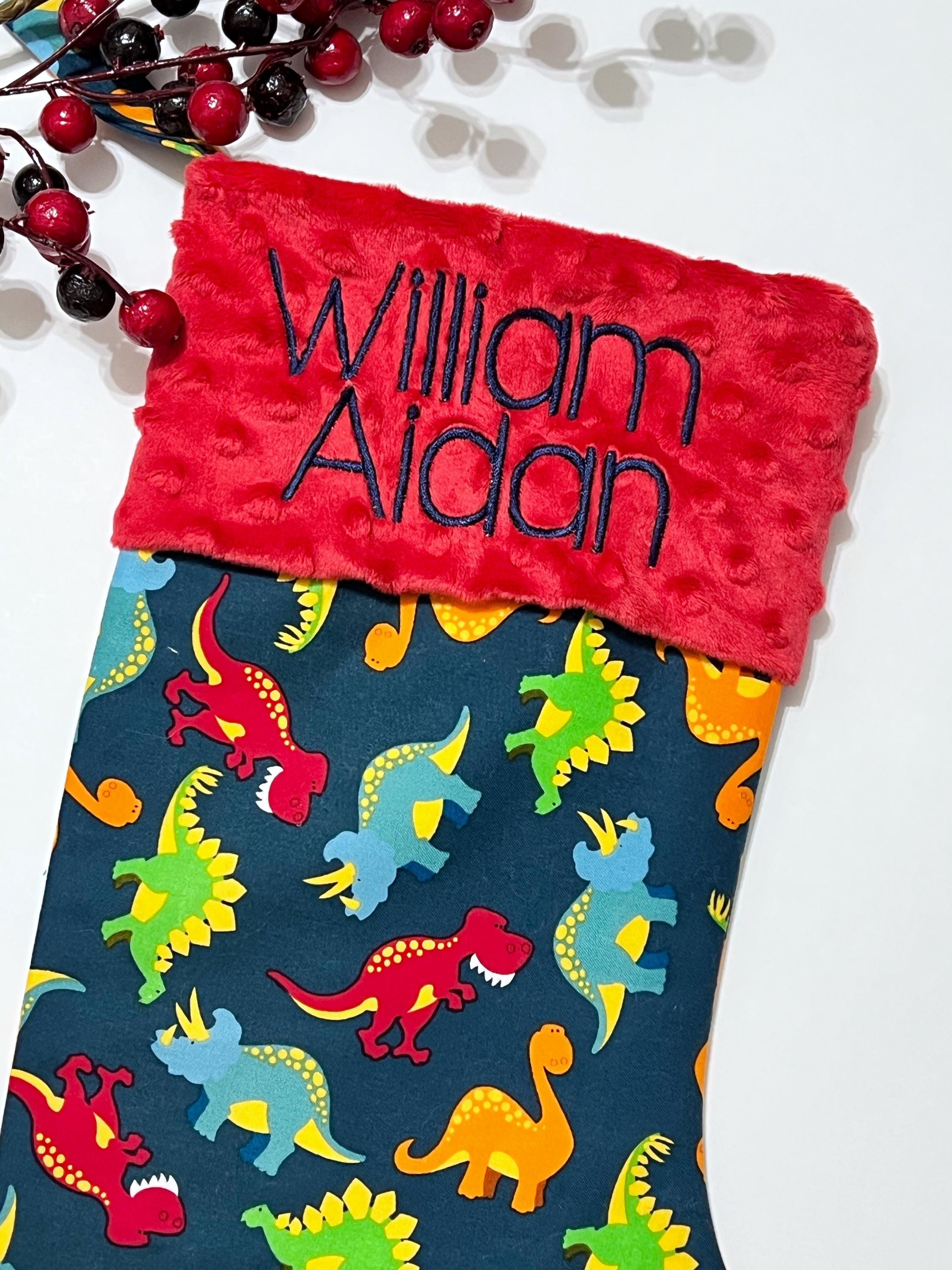 Personalized Christmas stocking in dinosaur cotton fabric, fully lined with minky dot cuff, 18” length, unique child stocking