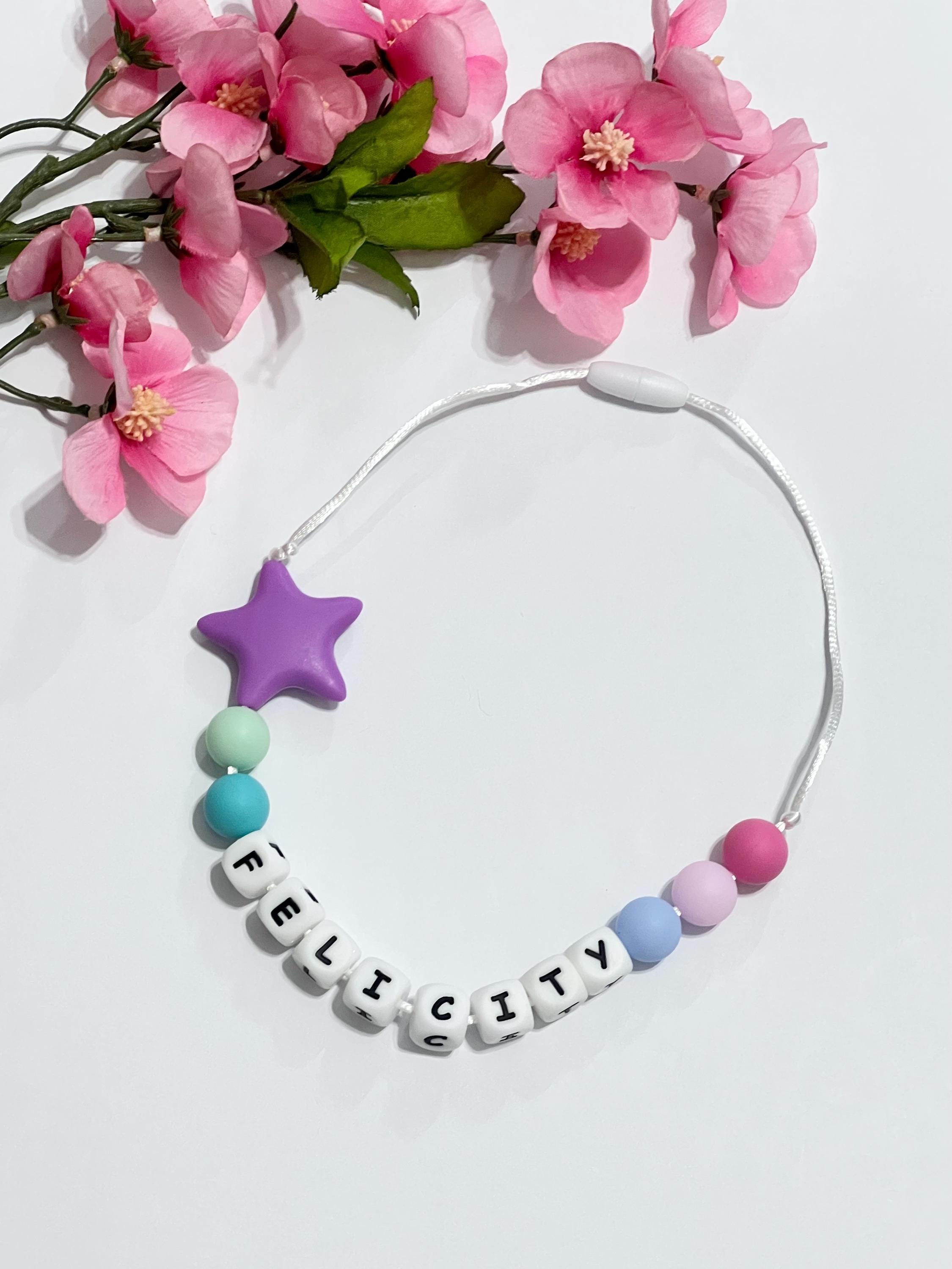 Toddler or child personalized necklace made from baby safe silicone beads, safe release clasp, colorful, plus a character or unique bead
