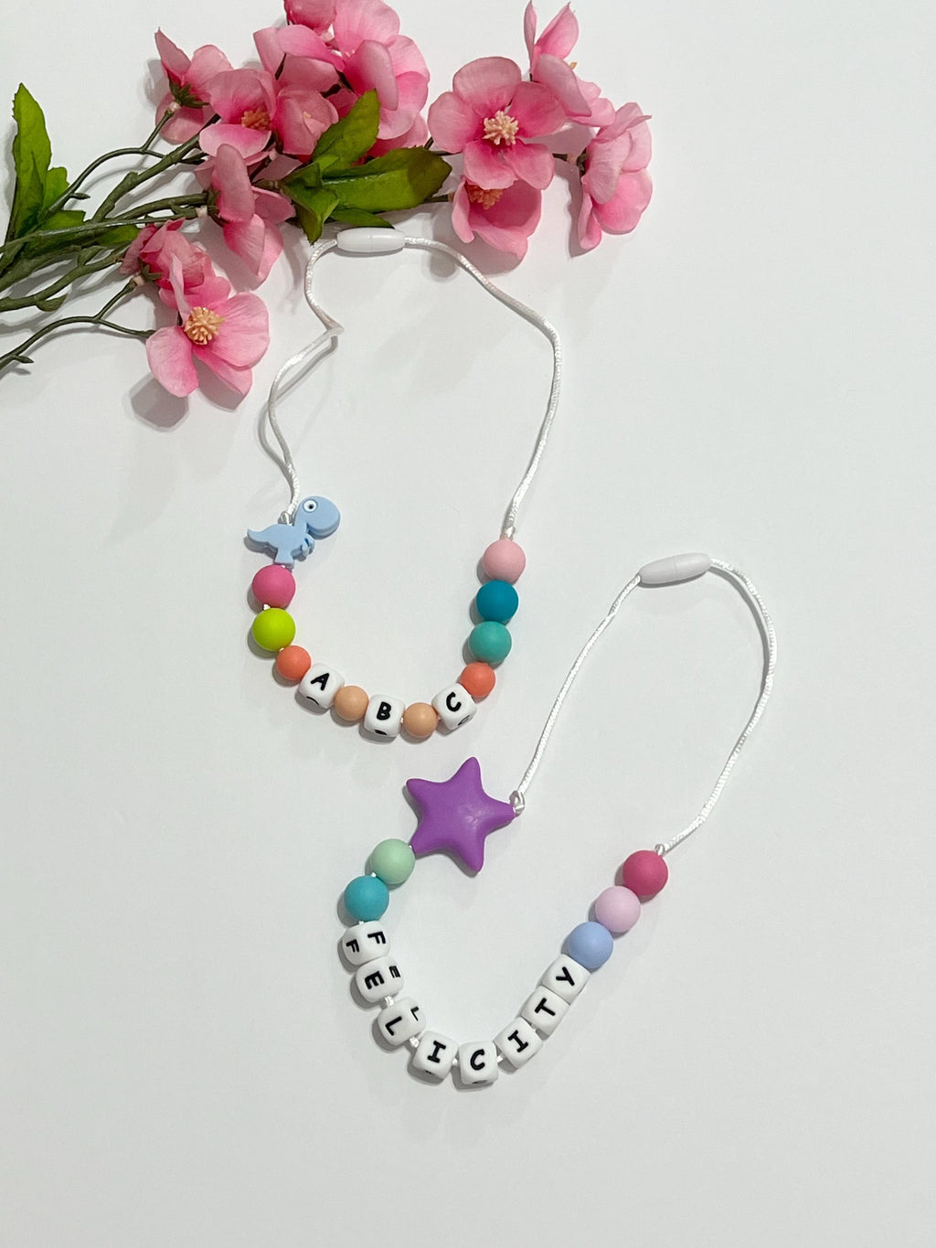 Toddler or child personalized necklace made from baby safe silicone beads, safe release clasp, colorful, plus a character or unique bead