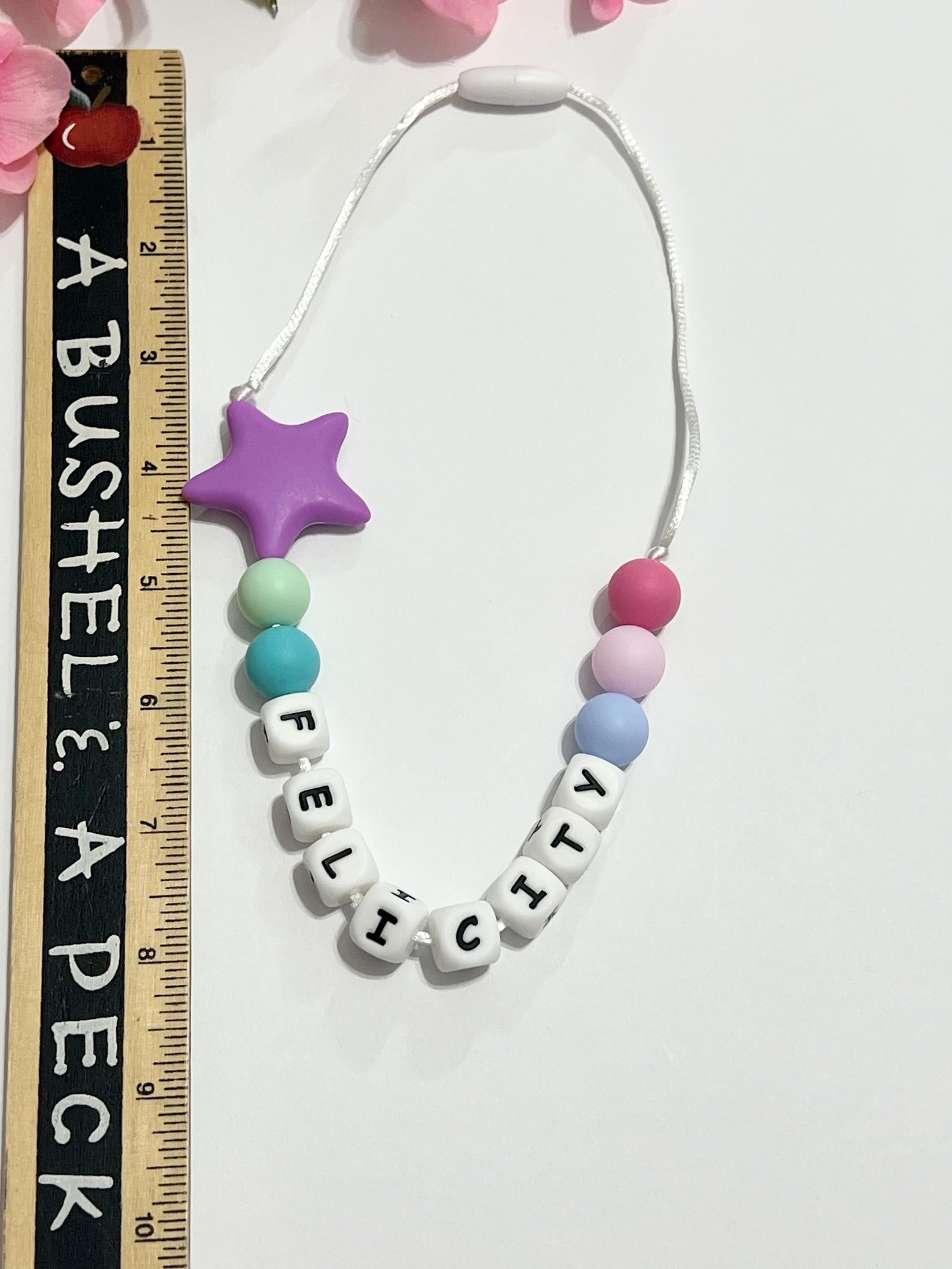 Toddler or child personalized necklace made from baby safe silicone beads, safe release clasp, colorful, plus a character or unique bead