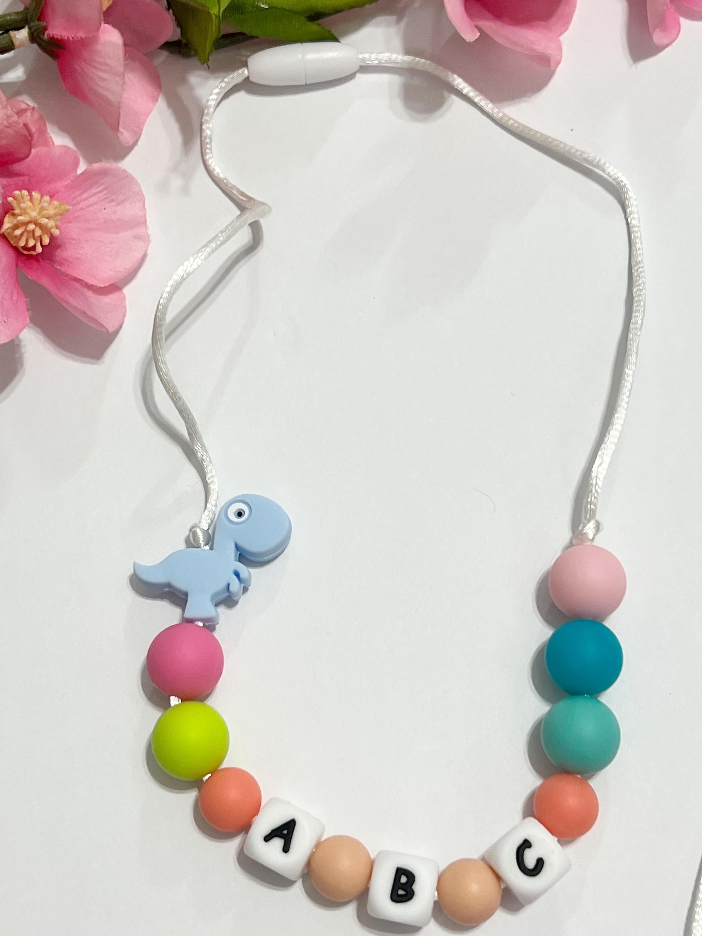Toddler or child personalized necklace made from baby safe silicone beads, safe release clasp, colorful, plus a character or unique bead