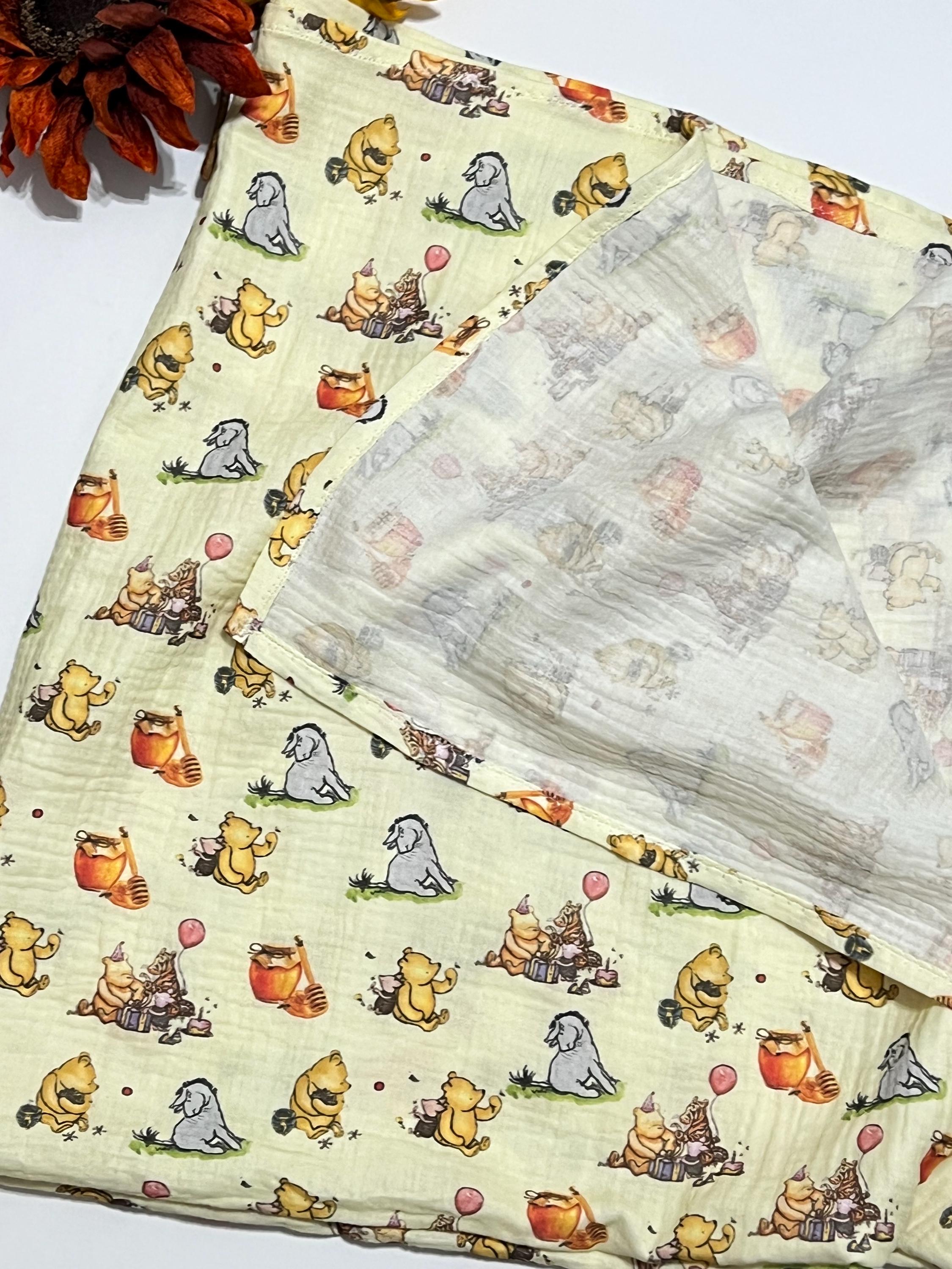 Baby swaddle blanket in classic Winnie the Pooh and Eeyore print yellow muslin gauze extra large 41”, soft and lightweight fabric, baby gift