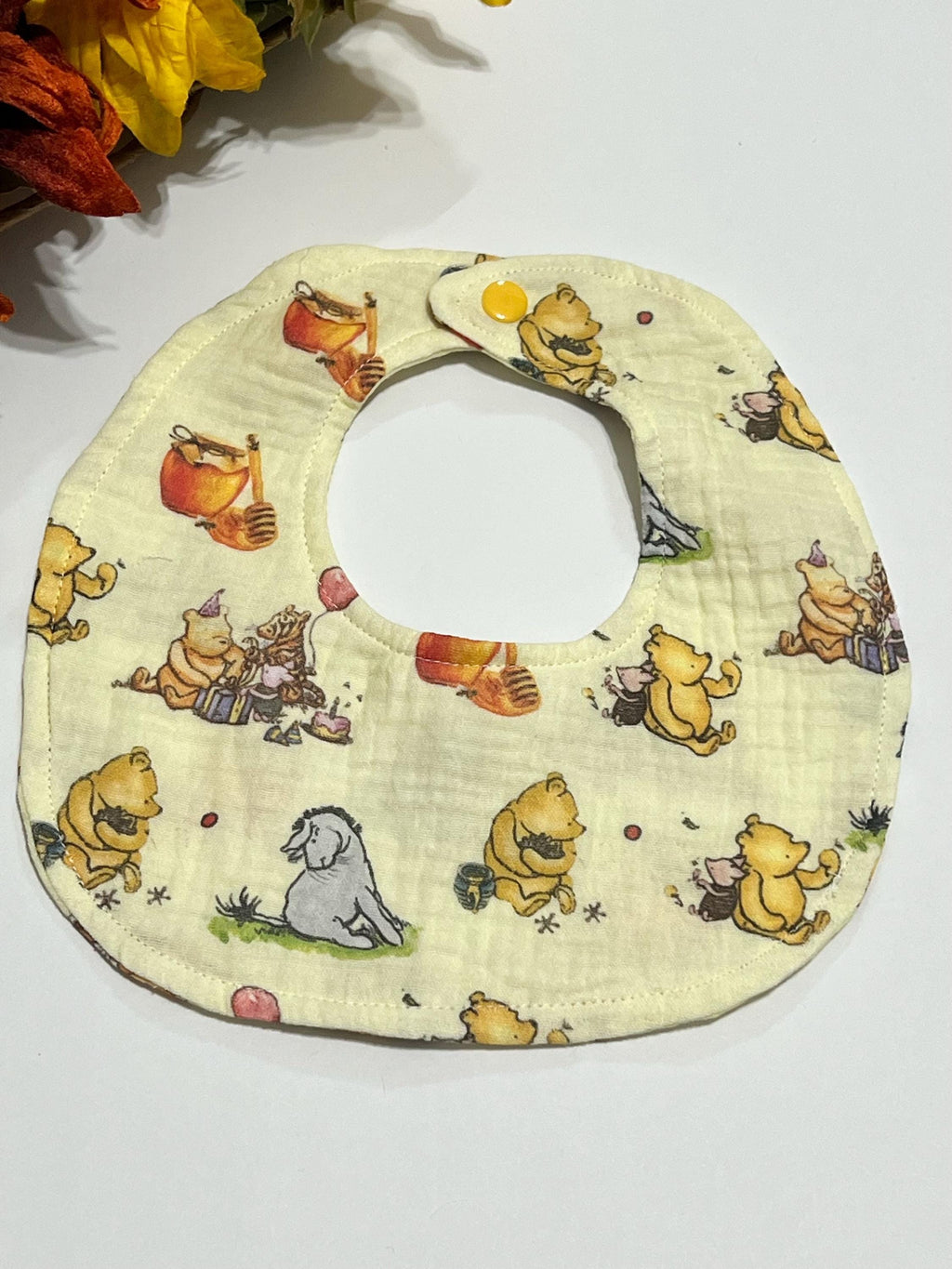 Baby drool bib in classic Winnie the Pooh, pink bow or woodlands print muslin gauze absorbant soft fabric with snap closure, lightweight