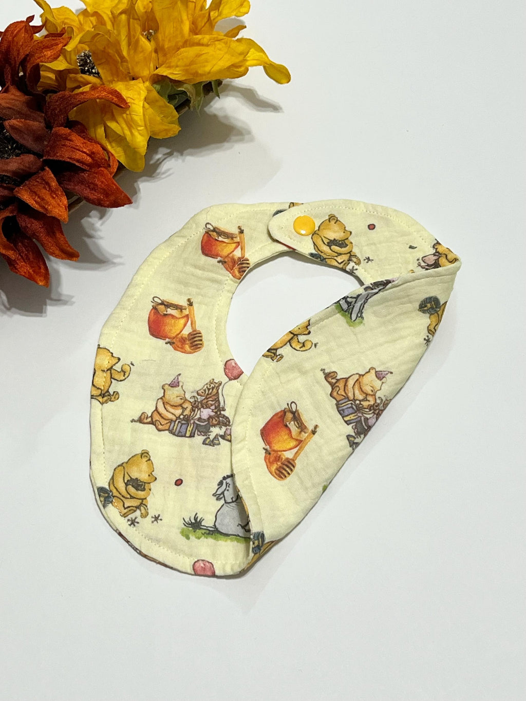 Baby drool bib in classic Winnie the Pooh, pink bow or woodlands print muslin gauze absorbant soft fabric with snap closure, lightweight