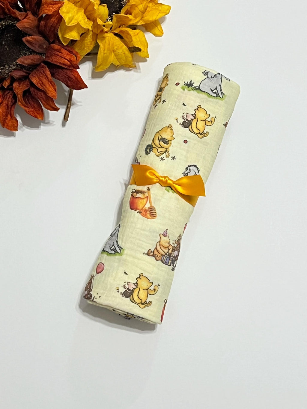 Baby swaddle blanket in classic Winnie the Pooh and Eeyore print yellow muslin gauze extra large 41”, soft and lightweight fabric, baby gift