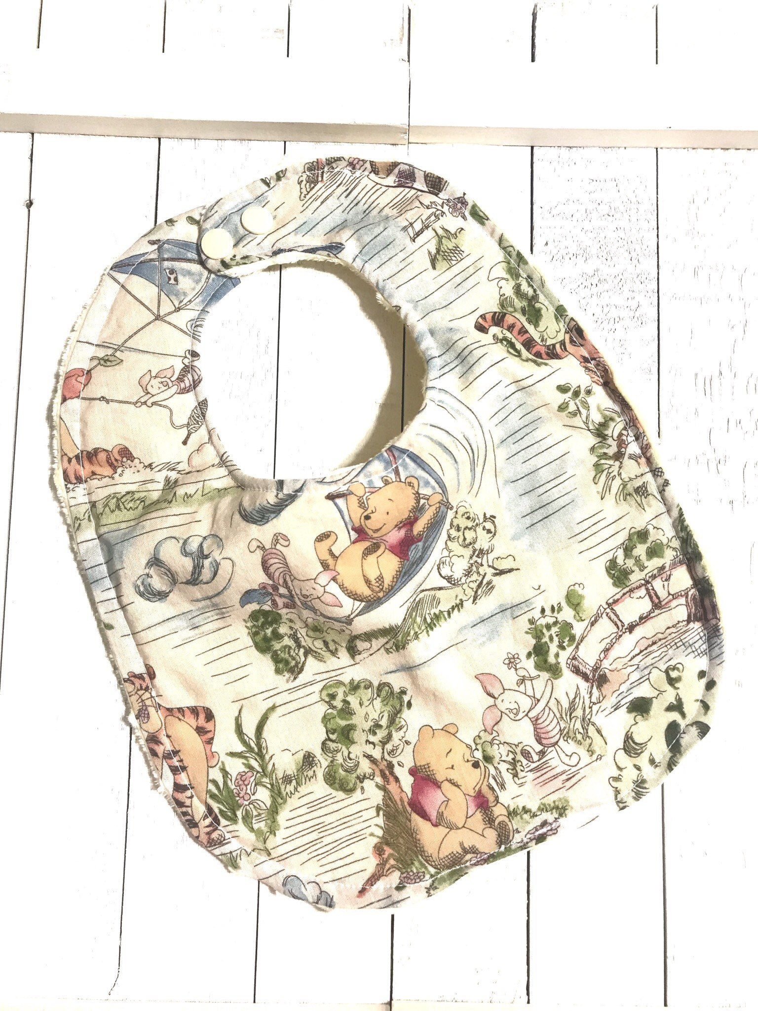 Baby toddler bib made from Winnie the Pooh fabric | Choose One | Reversible bib | gender neutral | Cotton and Minky | baby shower gift