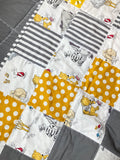 Baby crib quilt blanket made from Winnie the Pooh fabric for girl boy, can personalize this nursery bedding with cotton trim, perfect baby gift, measures 35” x 45”